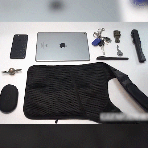 Anti-Theft Underarm Shoulder Bag with essentials being placed inside