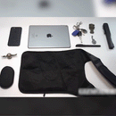 Anti-Theft Underarm Shoulder Bag with essentials being placed inside